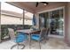 Covered patio with table, chairs, and screened enclosure at 12088 Uleta Ln, Orlando, FL 32827