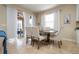 Elegant dining area with a wooden table and comfortable seating for four at 12088 Uleta Ln, Orlando, FL 32827