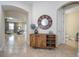 Elegant entryway with a stylish console table and a large mirror at 12088 Uleta Ln, Orlando, FL 32827