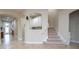 Inviting entryway with tiled floors and staircase at 12088 Uleta Ln, Orlando, FL 32827