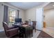 Bright home office with a large desk and comfortable leather chairs at 12088 Uleta Ln, Orlando, FL 32827