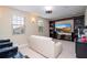 Home theater with large TV, built-in shelving, and wet bar at 12088 Uleta Ln, Orlando, FL 32827