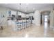 Bright kitchen features an island and white cabinets at 12088 Uleta Ln, Orlando, FL 32827
