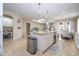 Open concept kitchen with island and breakfast bar at 12088 Uleta Ln, Orlando, FL 32827