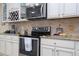 Modern kitchen with stainless steel appliances and granite countertops at 12088 Uleta Ln, Orlando, FL 32827