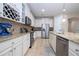 Spacious kitchen boasts stainless steel appliances and granite countertops at 12088 Uleta Ln, Orlando, FL 32827