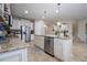 Open concept kitchen with island and stainless steel appliances at 12088 Uleta Ln, Orlando, FL 32827