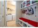 Convenient laundry room with washer, dryer, and built-in storage at 12088 Uleta Ln, Orlando, FL 32827