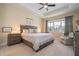 Spacious Primary bedroom with a king-size bed and calming decor at 12088 Uleta Ln, Orlando, FL 32827