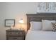Wooden nightstand with lamps and decorative elements at 12088 Uleta Ln, Orlando, FL 32827