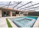 Inviting pool and spa area with outdoor kitchen and seating at 12088 Uleta Ln, Orlando, FL 32827