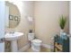 Clean powder room with pedestal sink and a decorative accent at 12088 Uleta Ln, Orlando, FL 32827