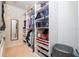 Large walk-in closet with custom shelving and drawers at 12088 Uleta Ln, Orlando, FL 32827