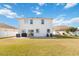 Home's backyard with patio and grassy area at 131 Cambria Grove Cir, Davenport, FL 33837