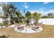 Relaxing backyard with firepit and seating area, perfect for outdoor gatherings at 131 Cambria Grove Cir, Davenport, FL 33837