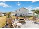 Spacious backyard with firepit and seating area at 131 Cambria Grove Cir, Davenport, FL 33837