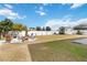 Landscaped backyard with firepit and seating at 131 Cambria Grove Cir, Davenport, FL 33837