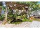 Charming backyard oasis featuring a serene pond and lush landscaping at 131 Cambria Grove Cir, Davenport, FL 33837