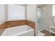 Relaxing bathroom with soaking tub and walk-in shower at 131 Cambria Grove Cir, Davenport, FL 33837
