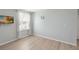 Small bedroom with large window and light walls at 131 Cambria Grove Cir, Davenport, FL 33837