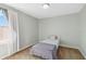Small bedroom with a single bed and window at 131 Cambria Grove Cir, Davenport, FL 33837