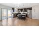 Modern kitchen with dark cabinets, granite counters, and island with seating at 131 Cambria Grove Cir, Davenport, FL 33837