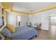 Spacious main bedroom with a ceiling fan and en-suite bathroom at 131 Cambria Grove Cir, Davenport, FL 33837