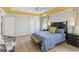 Main bedroom with wood bench and ceiling fan at 131 Cambria Grove Cir, Davenport, FL 33837