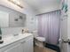 Bright bathroom featuring a shower/tub combo and vanity at 1404 Adair St, Ocoee, FL 34761