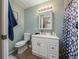 Clean bathroom with white vanity, shower, and toilet at 1404 Adair St, Ocoee, FL 34761