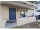 Inviting front porch with blue door and seating at 1404 Adair St, Ocoee, FL 34761