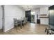 Eat-in kitchen with white cabinets, tile floor, and a view to the backyard at 1404 Adair St, Ocoee, FL 34761