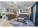 Spacious living room with two sofas, a coffee table, and a ceiling fan at 1404 Adair St, Ocoee, FL 34761