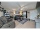 Spacious living room with two sofas, coffee table, and a view to the bedroom at 1404 Adair St, Ocoee, FL 34761