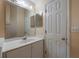Bathroom with vanity and a large mirror at 14528 Lycastle Cir, Orlando, FL 32826