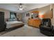 Main bedroom with a large bed and dresser at 14528 Lycastle Cir, Orlando, FL 32826