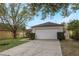 House exterior featuring a garage and driveway at 14528 Lycastle Cir, Orlando, FL 32826