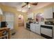 Bright kitchen featuring stainless steel appliances and white cabinetry at 14528 Lycastle Cir, Orlando, FL 32826