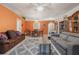 Open living and dining area with a comfy couch and dining table at 14528 Lycastle Cir, Orlando, FL 32826