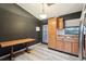 Kitchen with wood cabinets, a wood table, and a view of the living room at 1510 Chatsworth Ave, Deltona, FL 32738