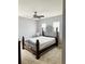 Bedroom with brown metal bed frame and ceiling fan at 15269 Galbi Dr, Orlando, FL 32828
