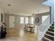 Open dining area with tile floors and a view of the staircase at 15269 Galbi Dr, Orlando, FL 32828