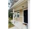Inviting front entrance with columns and a black door at 15269 Galbi Dr, Orlando, FL 32828