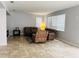 Living room with brown reclining furniture and tile floors at 15269 Galbi Dr, Orlando, FL 32828