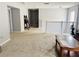 Upstairs hallway with plush carpeting and access to bedrooms at 15269 Galbi Dr, Orlando, FL 32828
