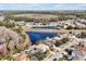 Aerial view of the neighborhood featuring ponds and lush landscape at 1633 Corner Meadow Cir, Orlando, FL 32820