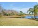 The spacious backyard overlooks a beautiful pond and natural wooded area at 1633 Corner Meadow Cir, Orlando, FL 32820