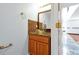 Charming powder room featuring vanity with granite countertop and bowl sink at 1633 Corner Meadow Cir, Orlando, FL 32820