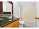 Bathroom with a decorative glass bowl sink and combination tub and shower at 1633 Corner Meadow Cir, Orlando, FL 32820
