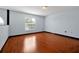 Spacious bedroom with hardwood floors and large window at 1633 Corner Meadow Cir, Orlando, FL 32820